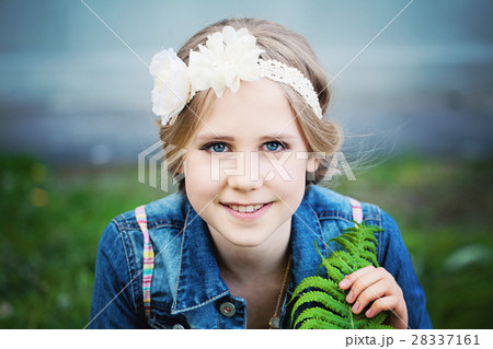 Young Girl with Blonde Hairstyle Outdoors 28337161