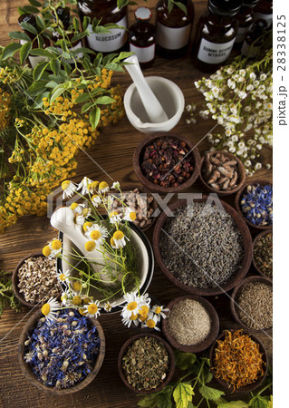 Natural medicine on wooden table background Natural medicine on wooden table background 28338125