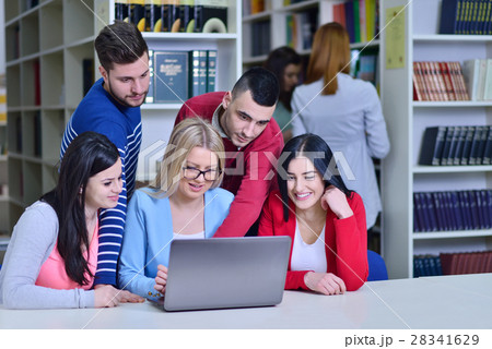 Group Of Students Working Together In Library With Group Of Students Working Together In Library With 28341629