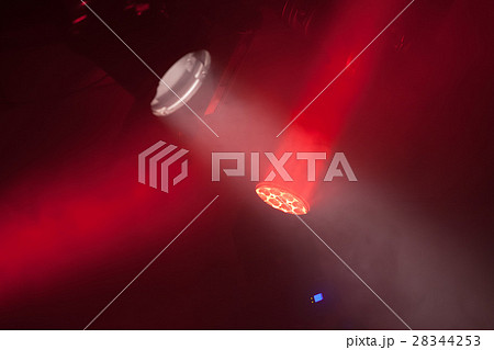 Stage spot lights with red beams in smoke 28344253