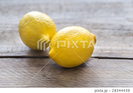 Fresh lemons on the wooden background 28344439
