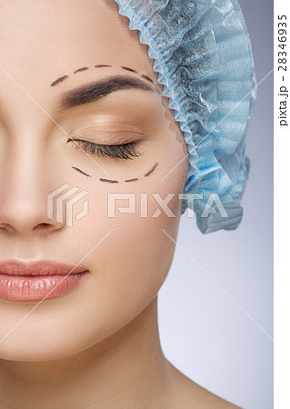 Girl with closed eyes in protective cap Girl with closed eyes in protective cap 28346935