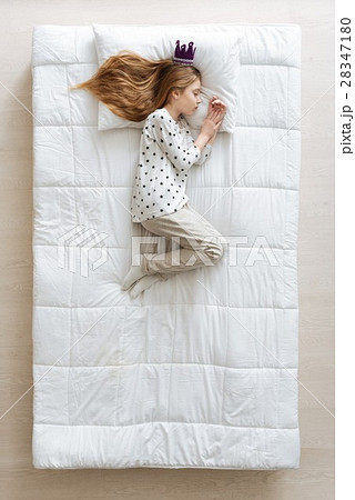 Serene child enjoying her dreams 28347180