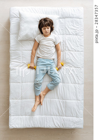 Lazy cute boy having a nap in the morning Lazy cute boy having a nap in the morning 28347357