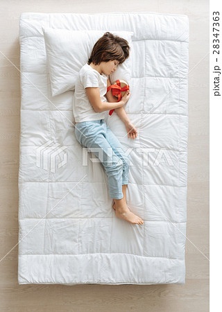 Dreamy kid hoping for a present Dreamy kid hoping for a present 28347363
