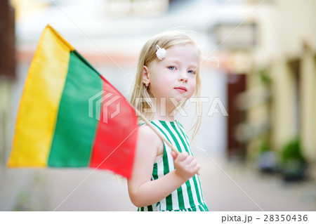 Cute little girl holding tricolor Lithuanian flag 28350436