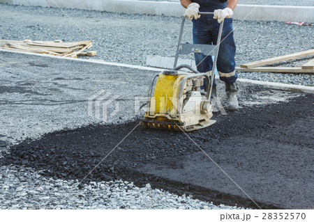 Worker use vibratory plate compactor 28352570