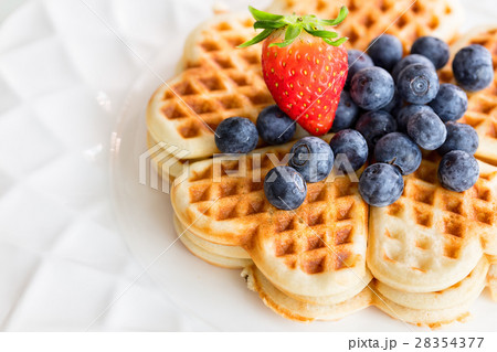 Fresh homemade heart shape waffles with blueberrie 28354377