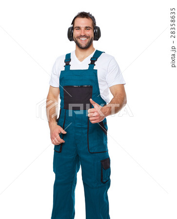 Worker in green uniform with protective earphones 28358635