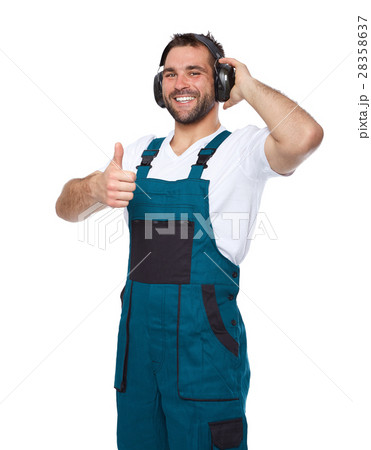 Worker in green uniform with protective earphones 28358637