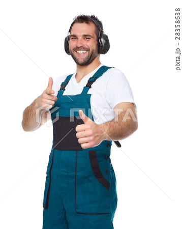 Worker in green uniform with protective earphones 28358638