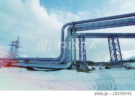 Steel pipelines and valves against blue sky 28359545