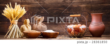 wheat ears with bowl of flour, milk and eggs wheat ears with bowl of flour, milk and eggs 28361850