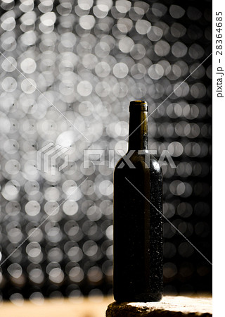 Bottle of wine in an aging cellar. 28364685