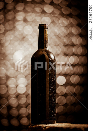 Bottle of wine in an aging cellar. Bottle of wine in an aging cellar. 28364700