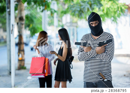 criminal hand holding shot gun woman on street 28368795