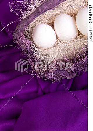 Easter. White eggs in purple basket on violet Easter. White eggs in purple basket on violet 28368957
