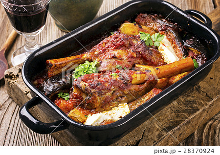 lamb knuckls braised in tomato sauce lamb knuckls braised in tomato sauce 28370924