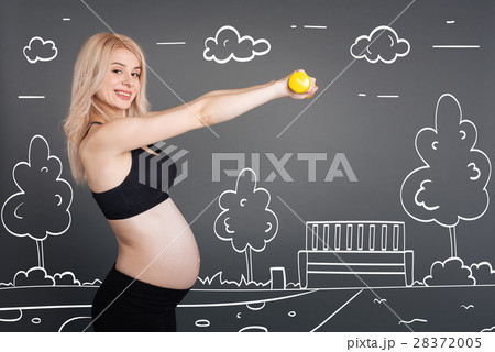 Cheerful pregnant woman training outdoors 28372005