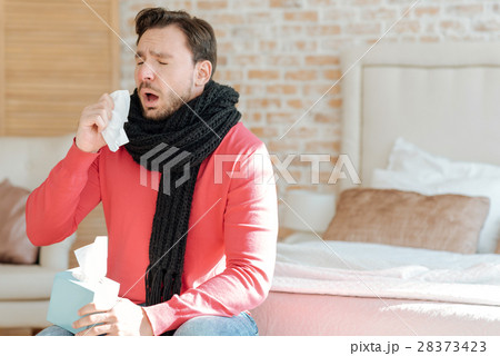 Young bearded man suffering from illness at home 28373423
