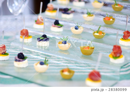 Plates with assorted finger food snacks  Plates with assorted finger food snacks  28380099