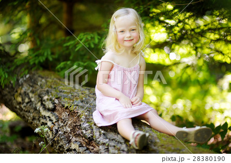 Adorable little girl hiking in the forest 28380190