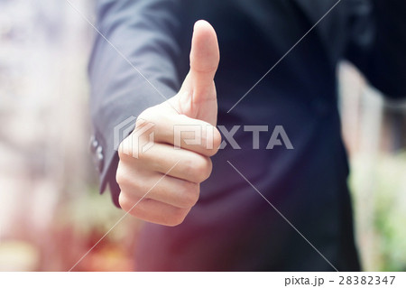 Businessman shows thumb up Businessman shows thumb up 28382347