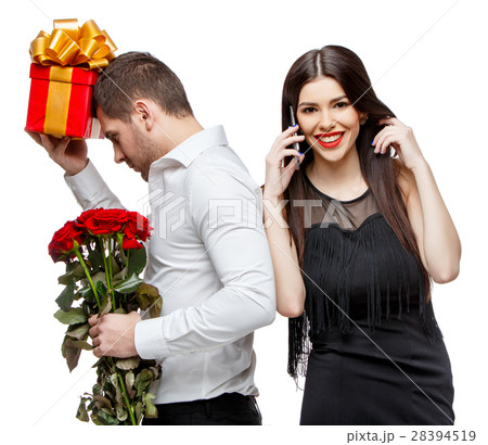 Young beautiful couple with present isolated on 28394519