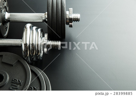 The metal dumbbell and weights. 28399885