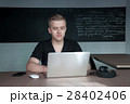 student is preparing for a lecture in classroom 28402406