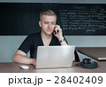 student is preparing for a lecture in classroom 28402409