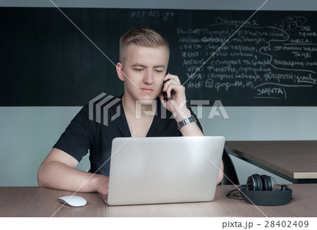 student is preparing for a lecture in classroom 28402409