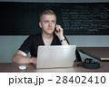 student is preparing for a lecture in classroom 28402410