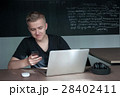 student is preparing for a lecture in classroom 28402411