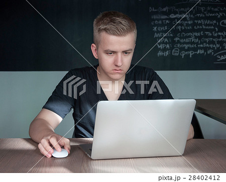 student is preparing for a lecture in classroom 28402412