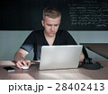 student is preparing for a lecture in classroom 28402413