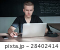 student is preparing for a lecture in classroom 28402414