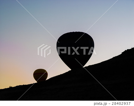 hot air balloons flying over the Cappadocia valley 28402937