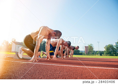Male athletics runners on starting line without 28403406