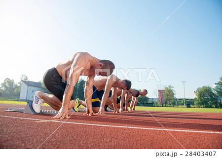 Male athletics runners on starting line without 28403407