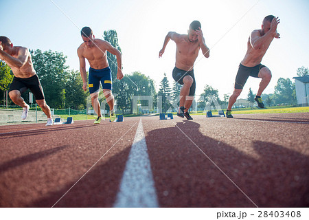 Male athletics runners on starting line without 28403408