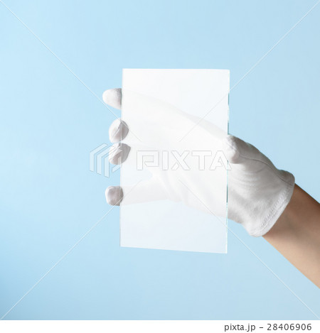 Scientist hand in glove show rectangle piece of new research prototype of transparent clear glass or plastic material 28406906