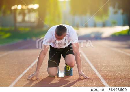 Athletic man on track starting to run. Healthy 28408600