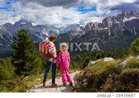 two tourist girls at the Dolomites two tourist girls at the Dolomites 28416687