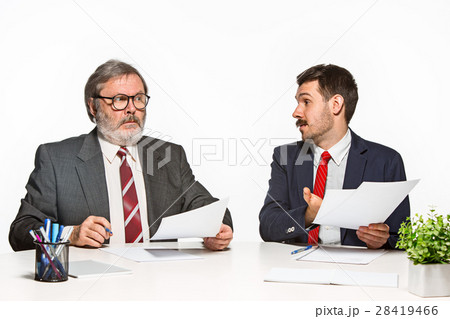 The two colleagues working together at office on The two colleagues working together at office on 28419466