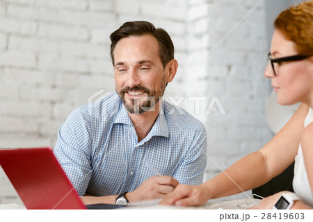 Educated middle aged couple communicating at home Educated middle aged couple communicating at home 28419603