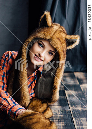beautiful sexy girl wearing brown fur hat 28420058