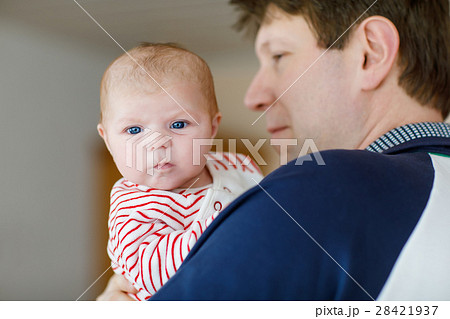 Happy proud young father with newborn baby Happy proud young father with newborn baby 28421937