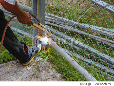Welder working a welding metal 28422079