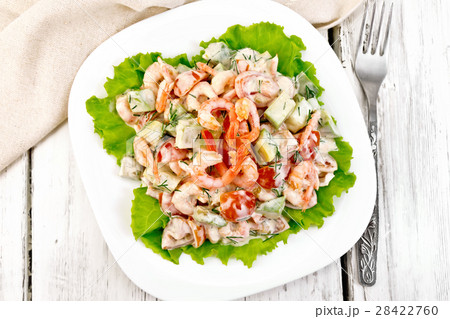 Salad with shrimp and avocado in plate on top 28422760